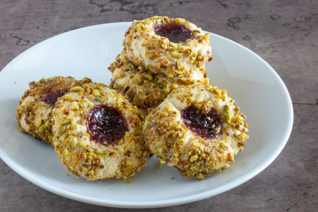 pistachio thumbprints with jam in the centers