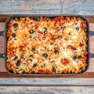 Baked pizza casserole on a cutting board