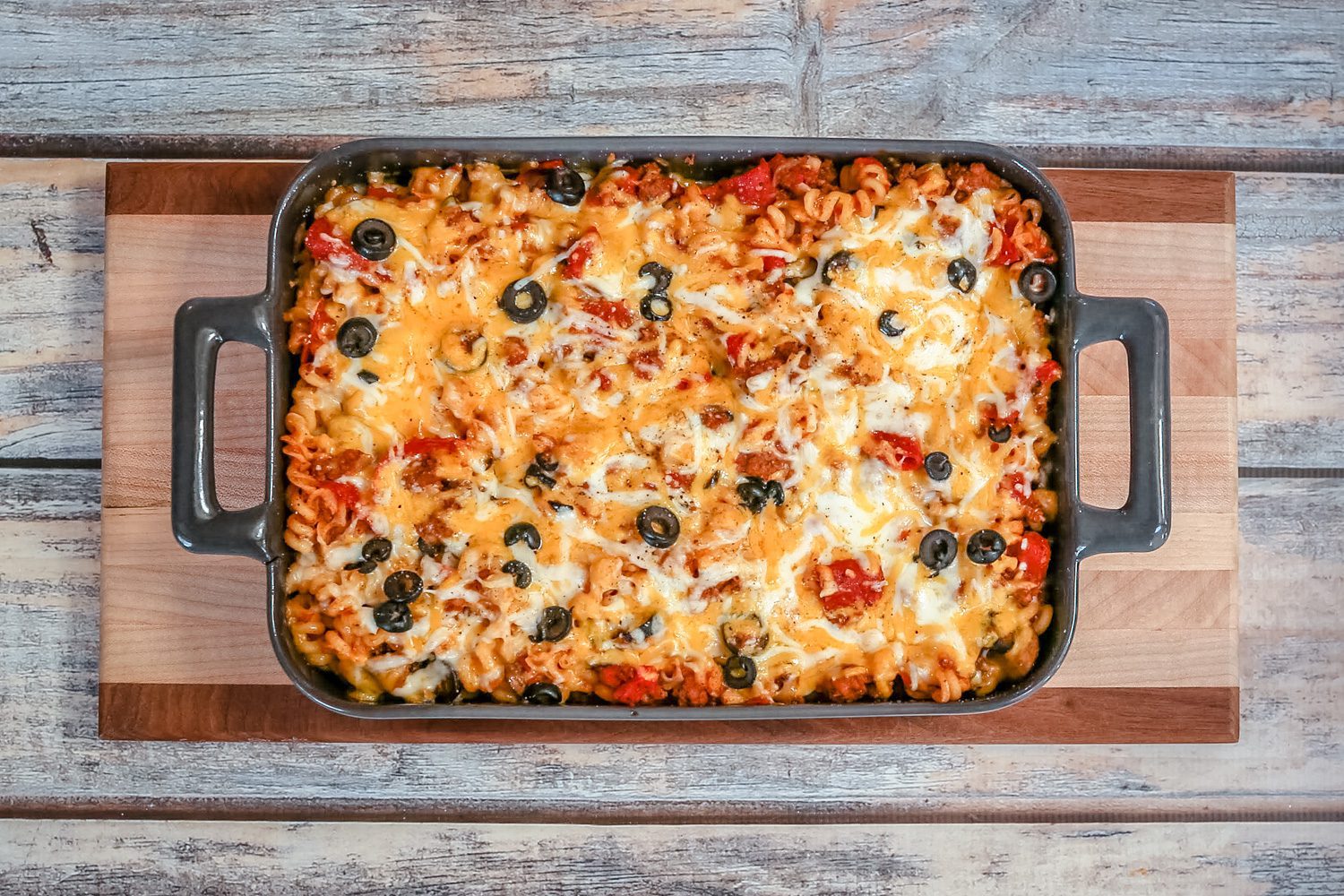 Baked pizza casserole on a cutting board