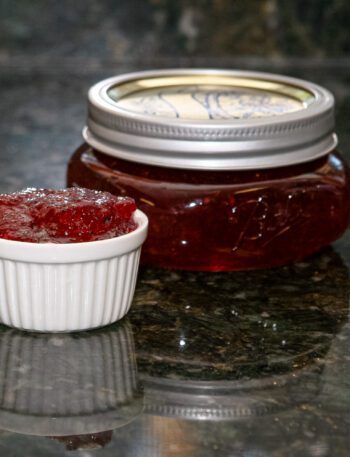 plum and peach jam in a canning jar