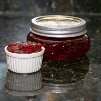 plum and peach jam in a canning jar