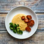 polenta with spicy sausage in a wide bowl