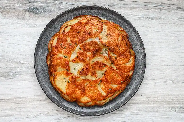 Thinly sliced, roasted potatoes layered and baked until crispy.