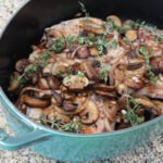 pork chops and mushrooms in a dutch oven