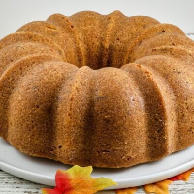 A brown sugar and pecan pound cake on a cake platter.