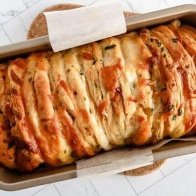 cheese and garlic pull apart bread baked with biscuits