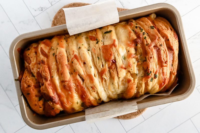 cheese and garlic pull apart bread baked with biscuits