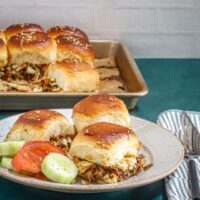 Fluffy dinner rolls filled with shredded beef and vegetables.
