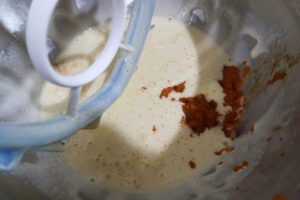 Pumpkin cake roll batter prep.