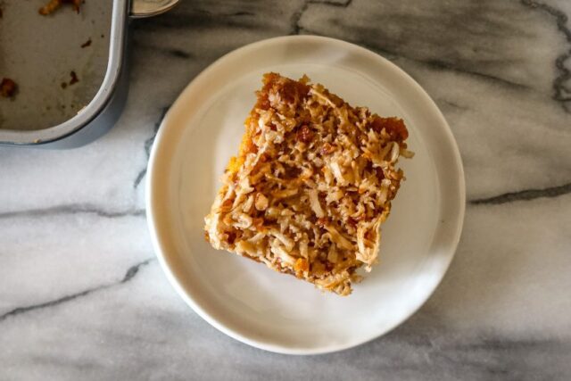 A slice of pumpkin cake on a small dessert plate.
