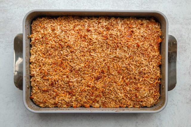 Baked pumpkin cake with coconut pecan topping.