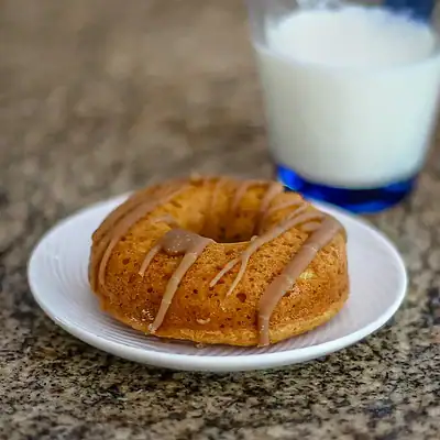Baked pumpkin donut on a plate.