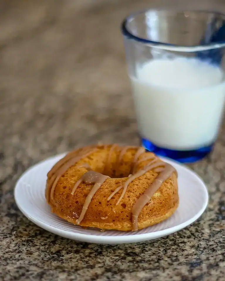 Baked pumpkin donut on a plate.