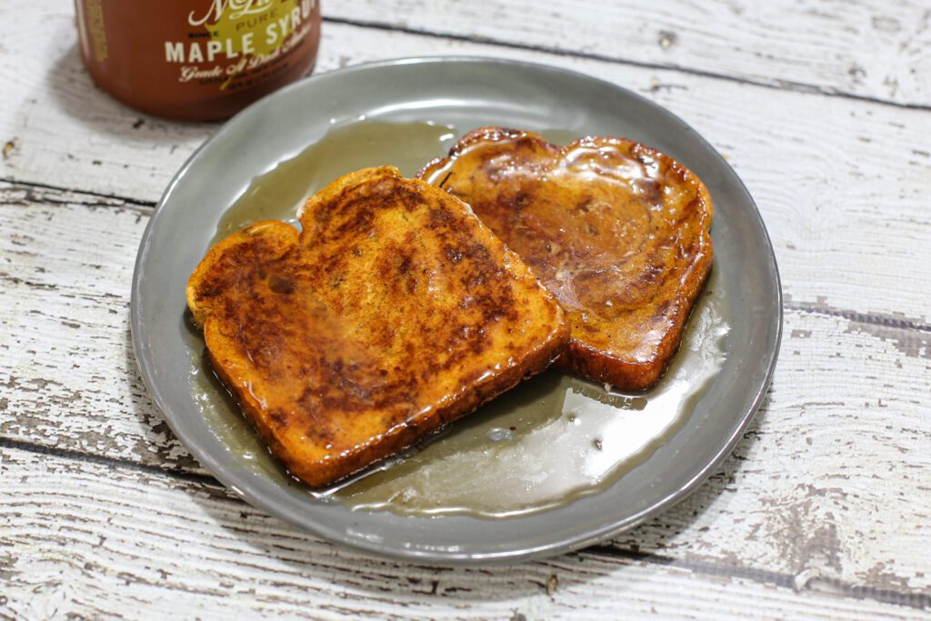 pumpkin french toast and a jug of maple syrup