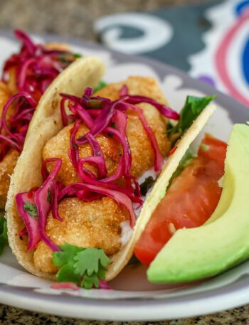 purple slaw on homemade fish tacos