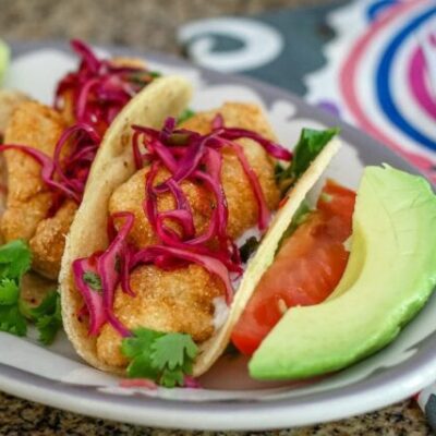 purple slaw on homemade fish tacos