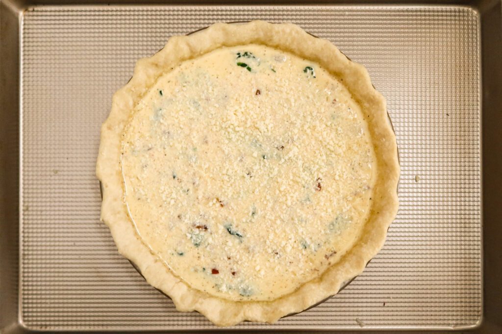 filled quiche ready to bake