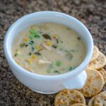 quick and easy chicken chowder in a bowl with crackers