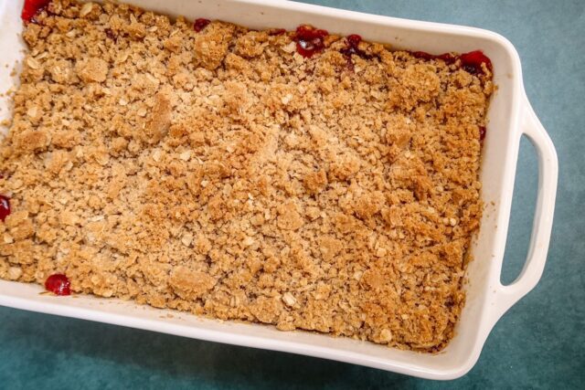 Baked cherry crisp in the baking dish.