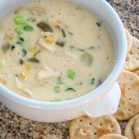 A bowl of quick chicken chowder with corn, green onions, and m