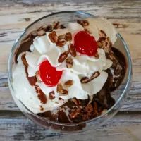 Filenames: chocolate sundae with whipped cream and cherries.jpg.