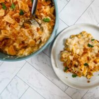 quick and easy scalloped corn in a serving bowl and on a small plate