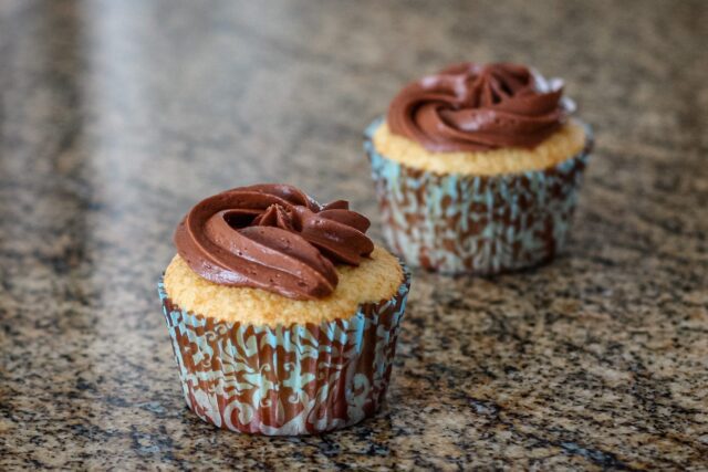 vanilla cupcakes with creamy chocolate frosting