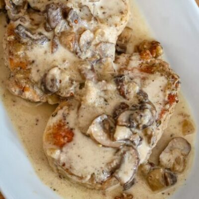 ranch pork chops with sauce on a platter