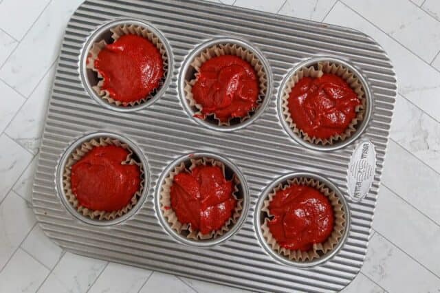 red velvet cupcake batter in the pan.