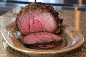 Roasted ribeye on a platter.
