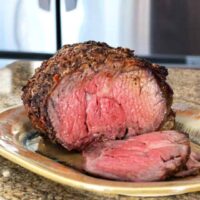 Juicy, perfectly cooked beef tenderloin roast with a seasoned crust.