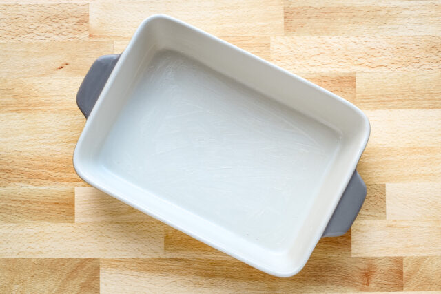 Buttered 1 1/2-cup baking dish for a Ritz chicken casserole.