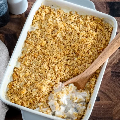 Golden-brown crumble topping on creamy dessert.