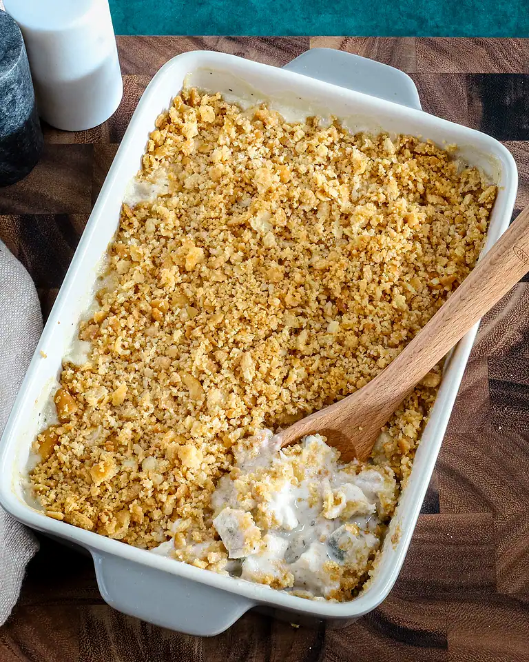 Golden-brown crumble topping on creamy dessert.