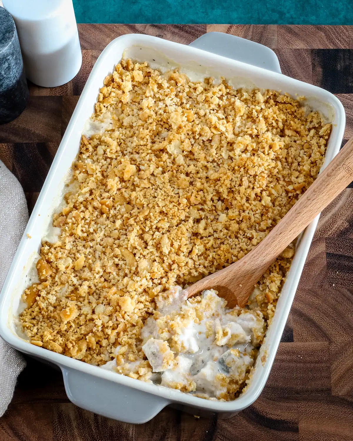 Golden-brown crumble topping on creamy dessert.