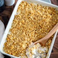 Serving up a baked Ritz chicken casserole with serving spoon.