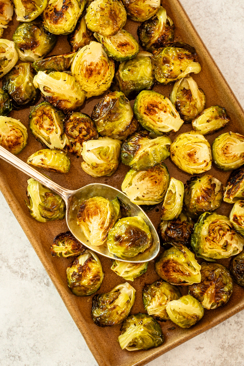 Roasted Brussels sprouts on a serving tray.