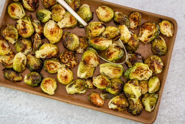 Roasted Brussels sprouts on a serving tray.