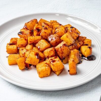 butternut squash on a plate with balsamic glaze