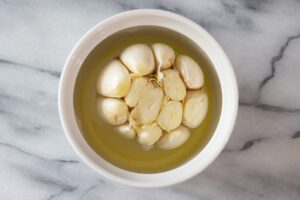 Garlic with olive oil in a ramekin.