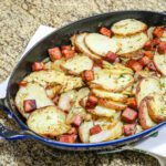 baking dish with roasted potatoes and ham