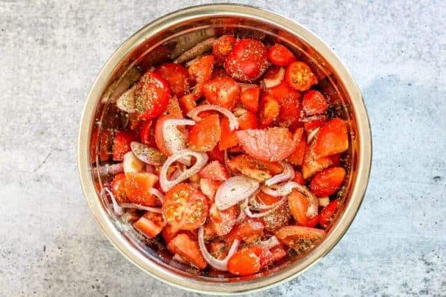 Rpasted tomato sauce prep. Tomatoes in a bowl.