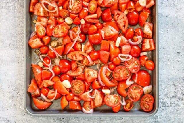 Tomatoes on a sheet pan.