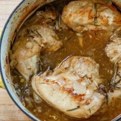 braised chicken with rosemary in a dutch oven