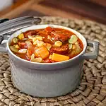 Hearty beef stew with vegetables and corn.