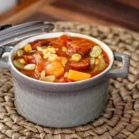 Hearty beef stew with vegetables and corn.