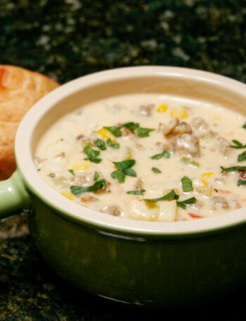 corn chowder with sausage in a soup bowl