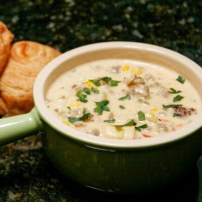 corn chowder with sausage in a soup bowl