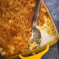 scalloped corn casserole in a baking dish