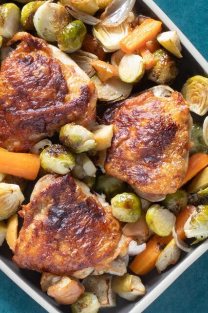 roasted chicken thighs with brussels sprouts and apples and carrots